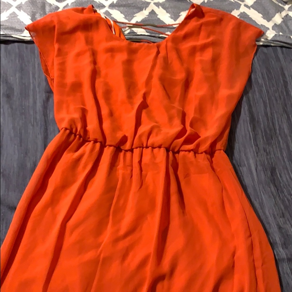 Orange dress with gold metal pieces in back